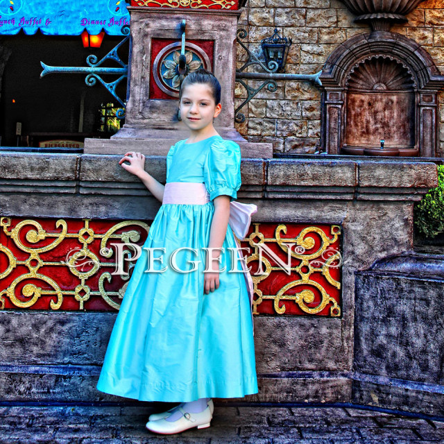 Our customer chose this Tiffany Blue and Peony Pink silk flower girl dress for her photo shoot at Disney World.